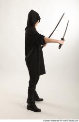 Woman Adult Average White Fighting with sword Standing poses Coat